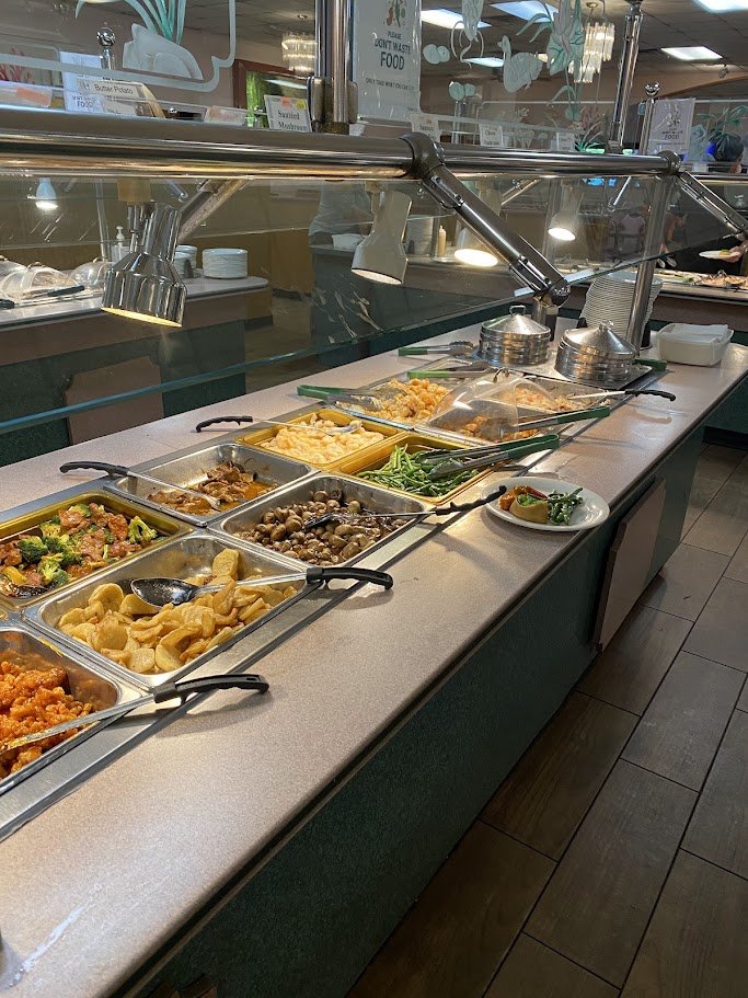 Buffet trays lined with hot Chinese dishes